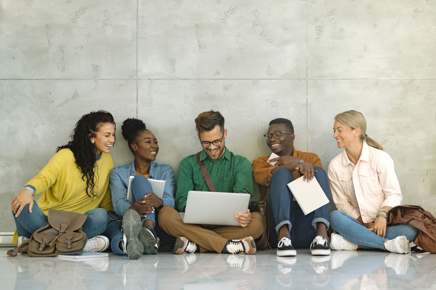 Students collaborating with a laptop at a Ghanaian university